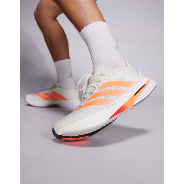 adidas Running Boston 13 trainers in orange and white | ASOS display picture 1