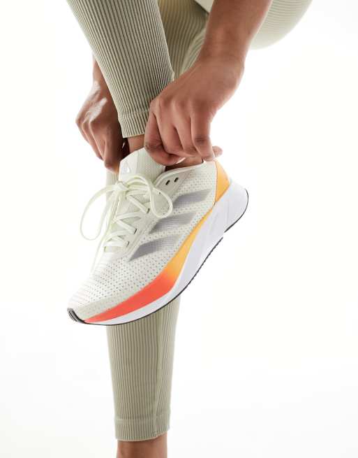  adidas Running Duramo SL trainers in off white and orange