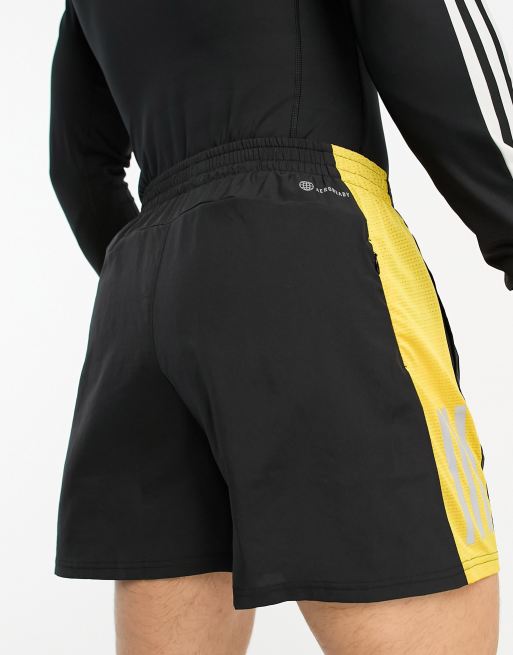 adidas Running Own The Run 5 inch shorts in black and yellow