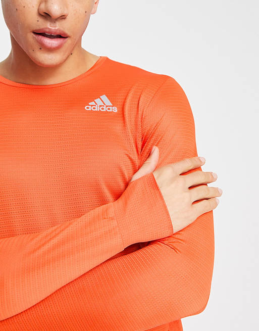 adidas Running Own The Run long sleeve t-shirt in orange | ASOS
