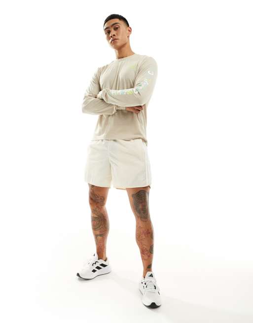 adidas Running Own The Run long sleeve top with graphic in beige, 3 of 4