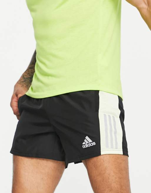 adidas Running Own The Run shorts in black and lime green