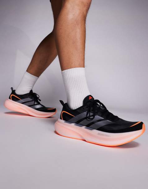 adidas Running Supernova Glide trainers in black and orange - view 1