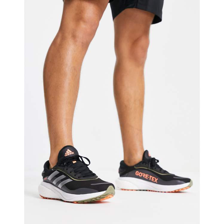 adidas Running Supernova trainers in black |