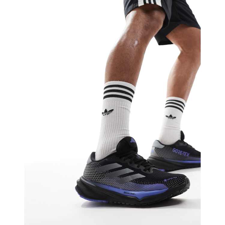adidas Running Supernova GTX trainers in black and blue