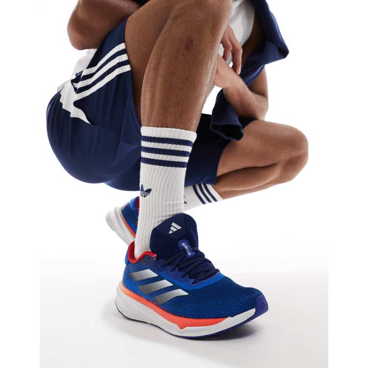 adidas Running Supernova Stride Sneaker in Marineblau und Orange ASOS