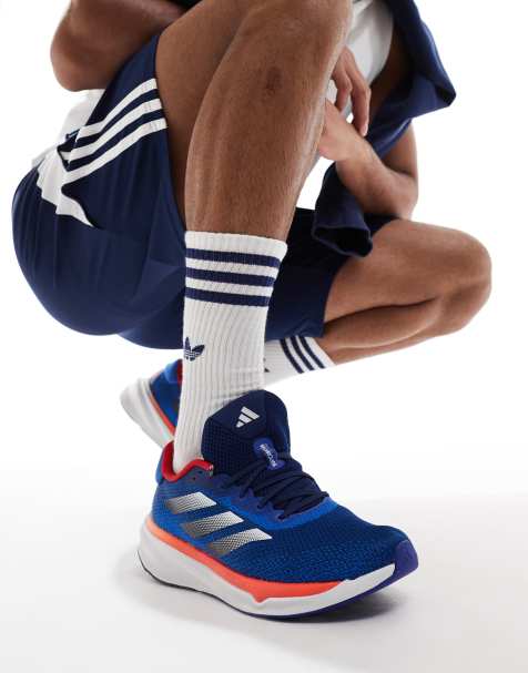adidas - Running Supernova Stride - Sneakers blu navy e arancioni - view 1