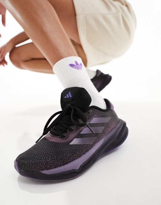 adidas - Running - Supernova Stride - Sneakers in zwart en blauw