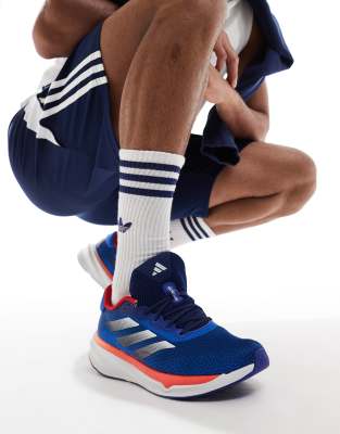 adidas performance adidas Running Supernova Stride trainers in navy and orange