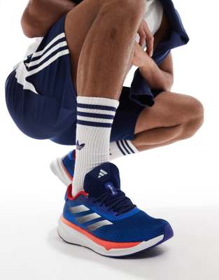 adidas Running Supernova Stride trainers in navy and orange