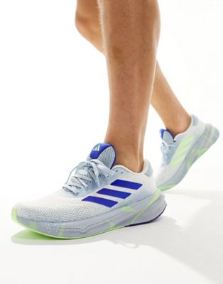 adidas Running Supernova Stride trainers in white blue and green