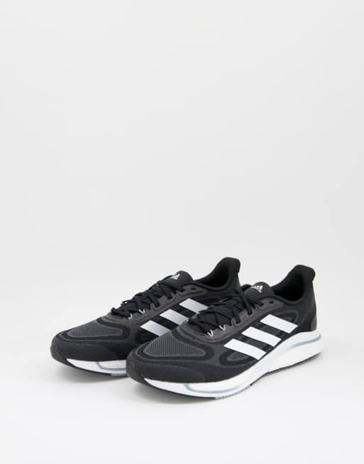 adidas Running Supernova + trainers in black and white | ASOS