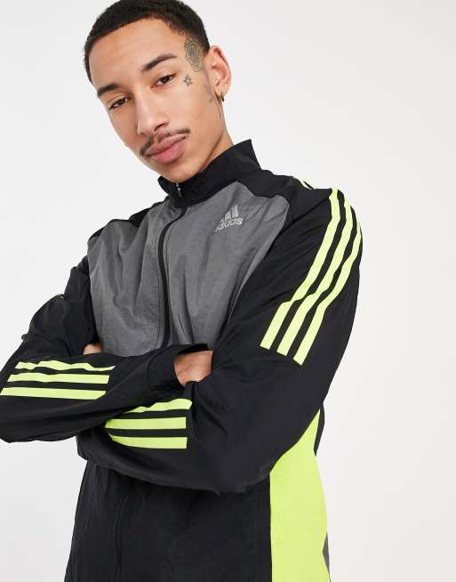 adidas Running track jacket in black and yellow