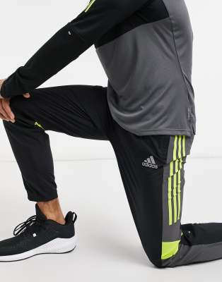 black and yellow adidas pants