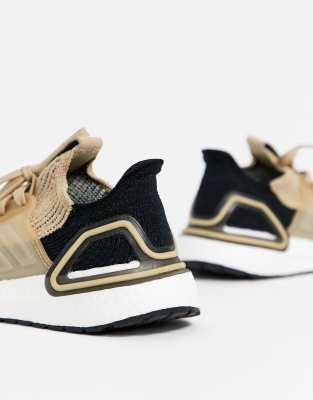 black and beige trainers