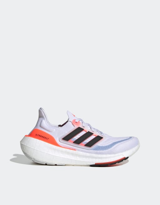 Adidas white store and orange shoes