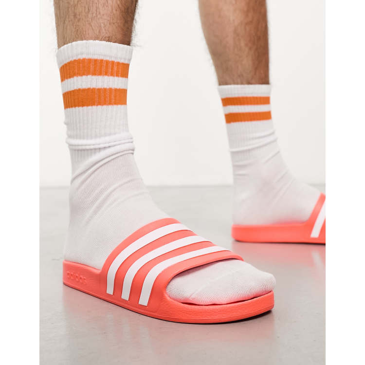 Adidas store orange slippers