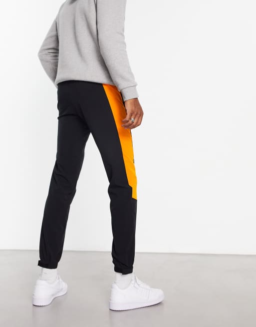 Black and store orange sweatpants