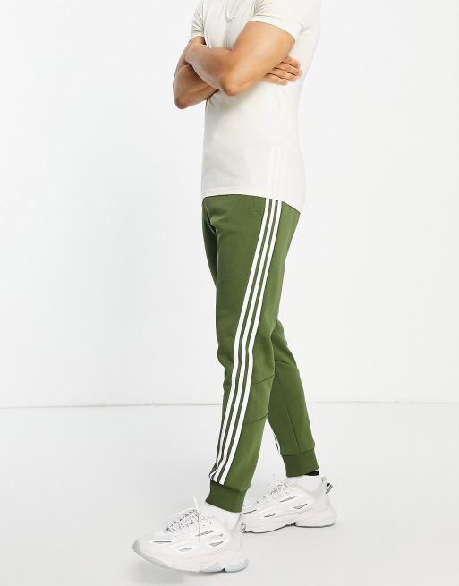 adidas Sportswear 3 stripe joggers in khaki