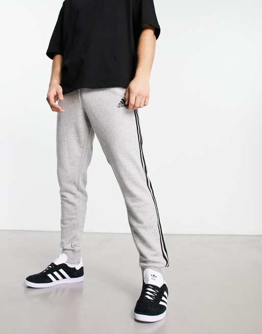 Grey adidas sweatpants with white online stripes