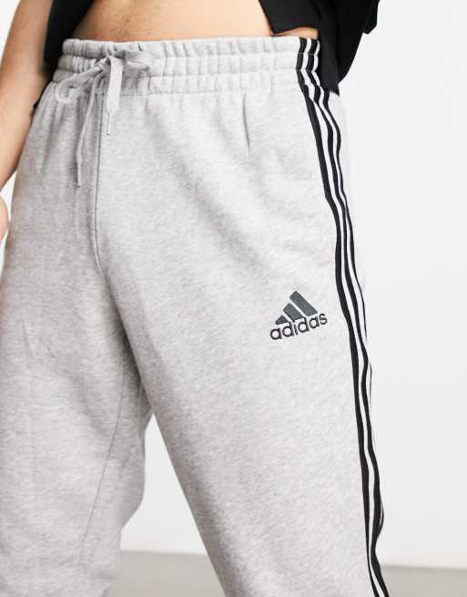 Grey adidas sweatpants hot sale with black stripes