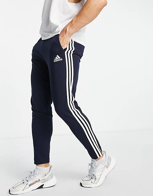 adidas Sportswear Essential 3 stripe joggers in navy | ASOS