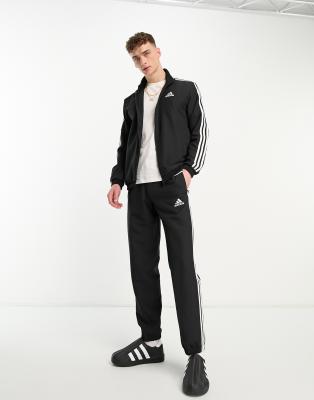 adidas Sportswear Essential woven tracksuit in black  - ASOS Price Checker