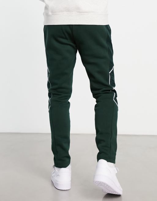 adidas Sportswear Pantalon de jogging a passepoil reflechissant Vert fonce