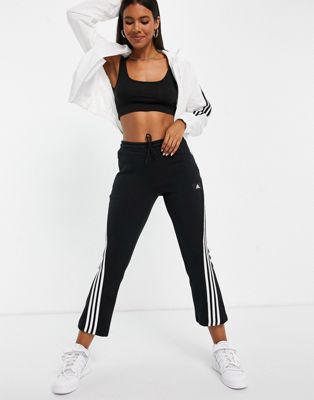 adidas Sportswear flared trousers with three stripes in black - ASOS Price Checker