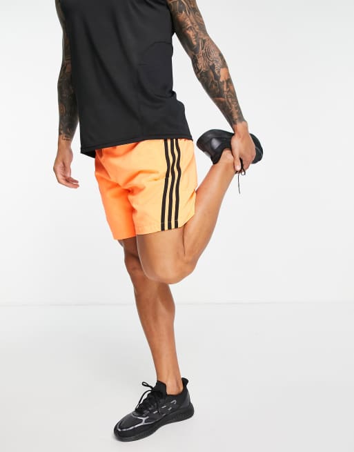 adidas Sportswear – Pomarańczowe szorty z 3 paskami, 3 z 4