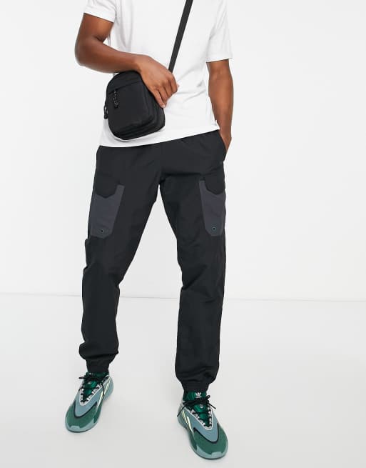 adidas Sportswear woven joggers with tonal three stripes in black