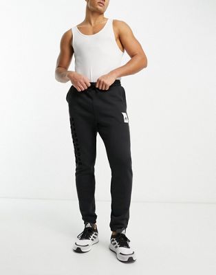 adidas Sportwear Lounge fleece joggers in black
