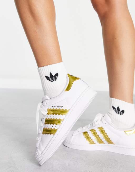 Adidas superstar clearance gold stripe nz