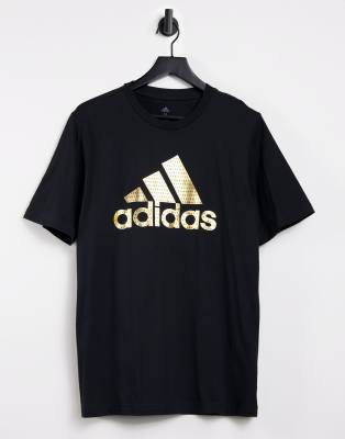 Black adidas shirt store with gold logo