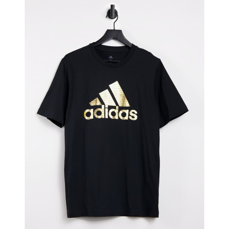 Black adidas shirt store with gold logo