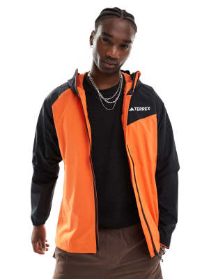 adidas performance adidas Terrex outdoors waterproof jacket in orange and black