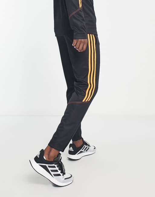 Jogging adidas noir sale orange