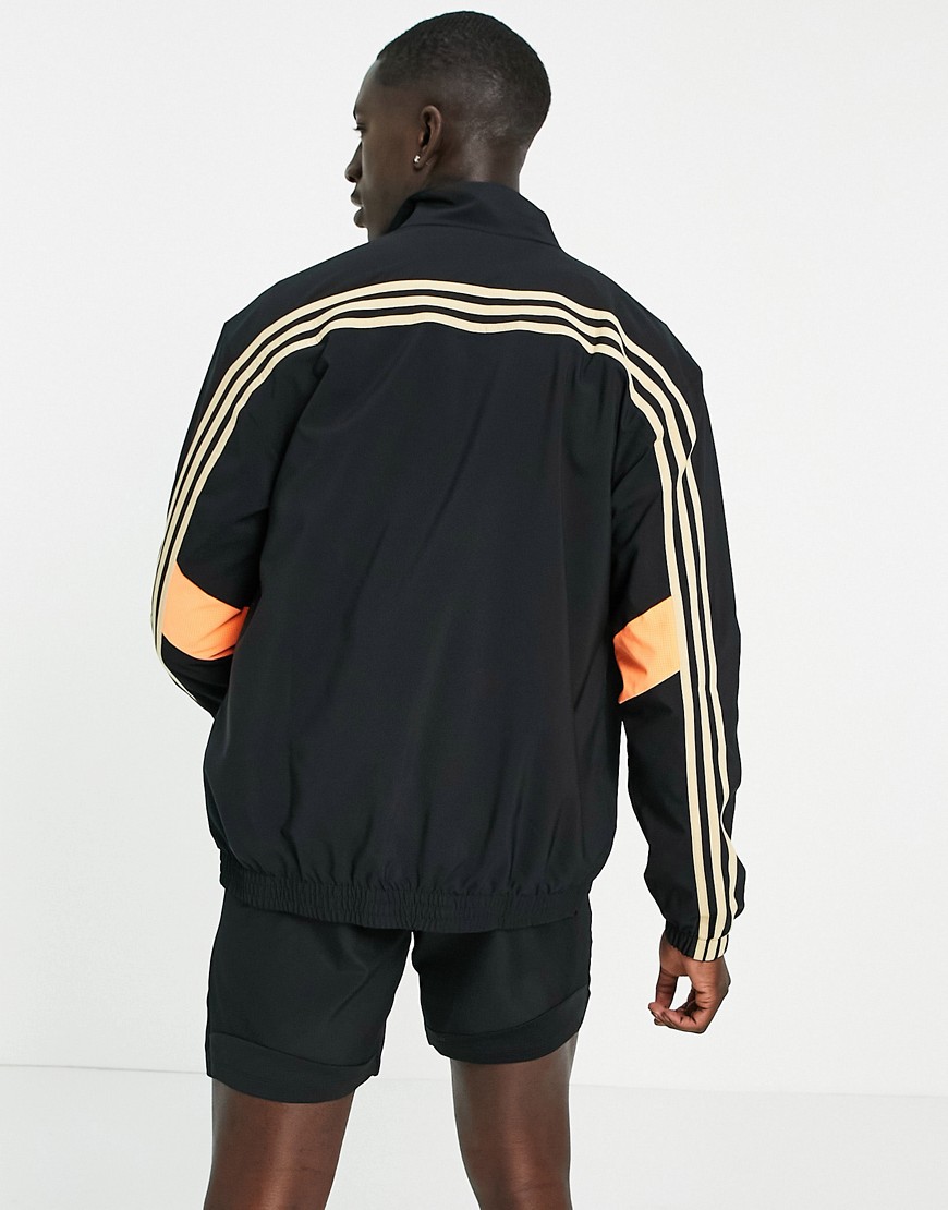 Adidas Training 3 stripe track jacket in black and orange