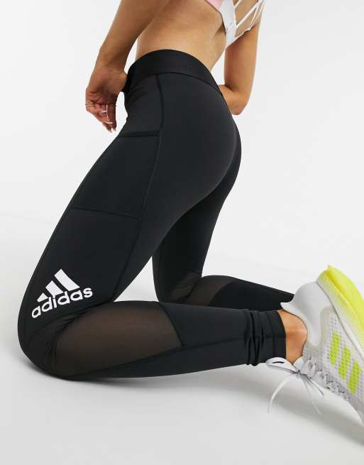 Adidas leggings with store logo down the side