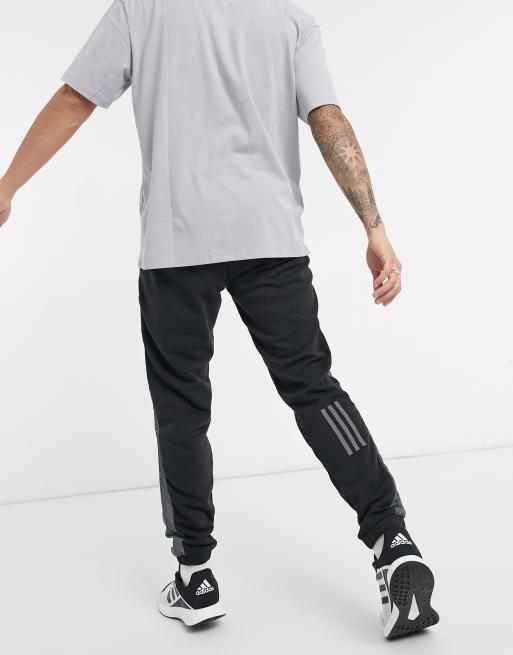 Adidas originals joggers with cut and sew in online black