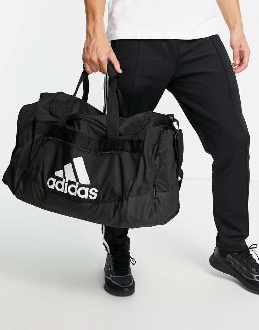 adidas Training Defender IV medium duffle bag in black | ASOS