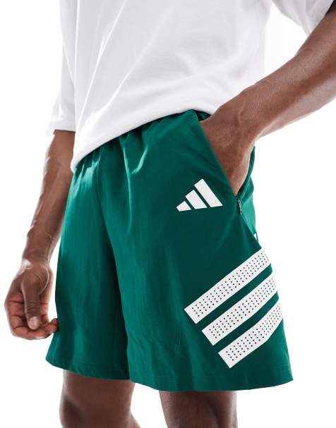 adidas Training Essentials gym 3 stripe shorts in dark green - view 1