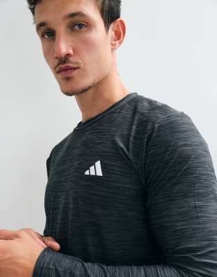 adidas Training Essentials long sleeve top in black wash | ASOS