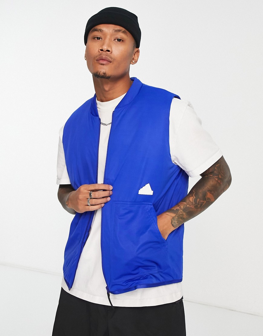 adidas Training Future Lounge rubber logo puffer vest in blue-White