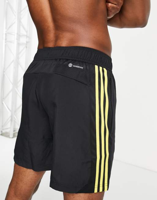 adidas Training HIIT yellow 3 stripe shorts in black