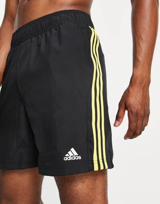 Black shorts on sale with yellow stripe