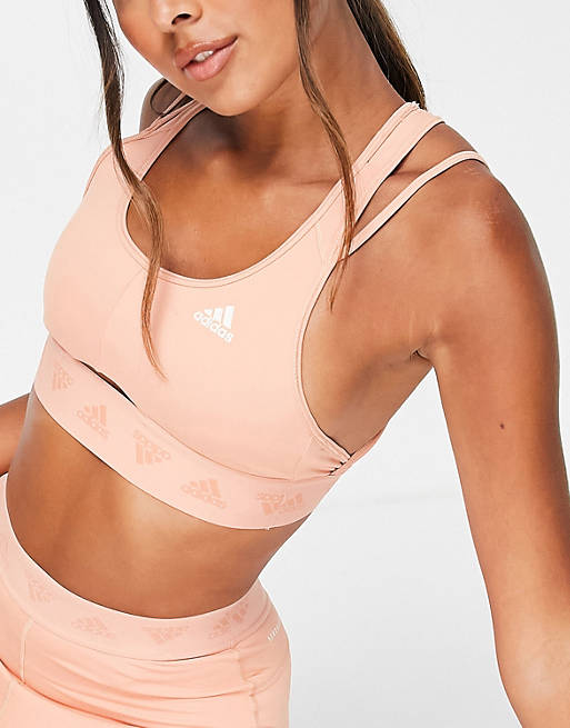 adidas Training light support sports bra with cut out detail in blush pink