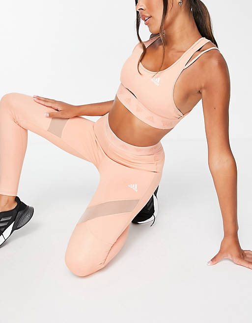  adidas Training light support sports bra with cut out detail in blush pink 