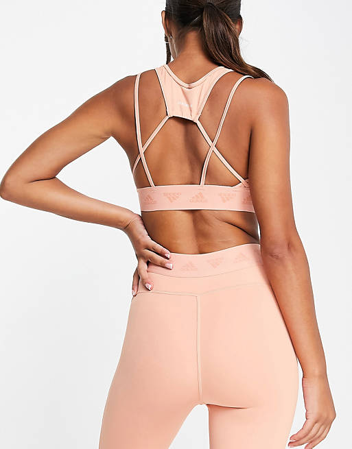  adidas Training light support sports bra with cut out detail in blush pink 