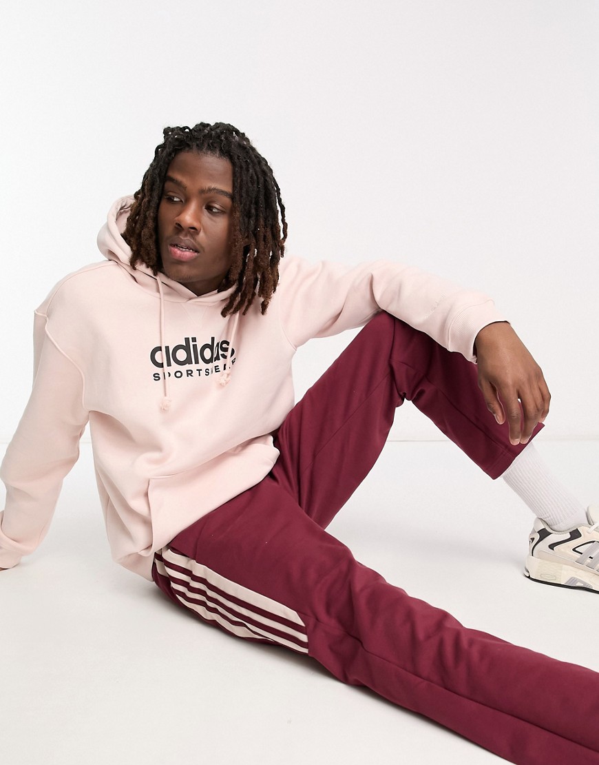 adidas Training linear logo hoodie in light pink-Brown